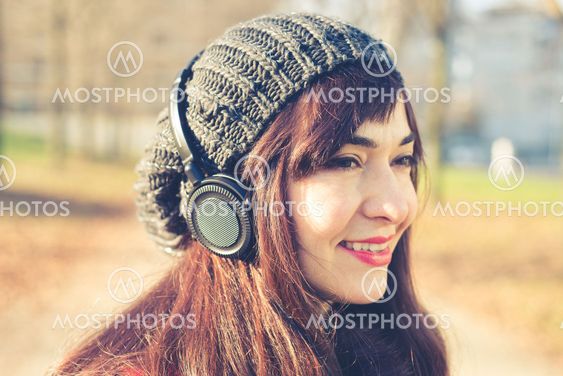 beautiful woman red coat listening music