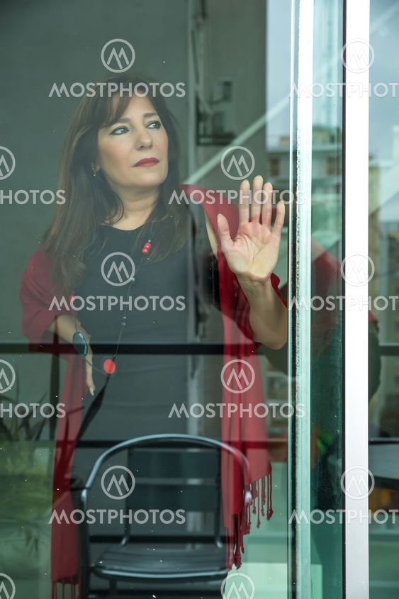 Mature woman looking out the window