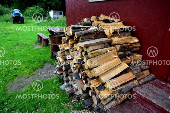 wood for the stove against the wall