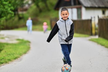 Children playing together in a park or engaging in a game.