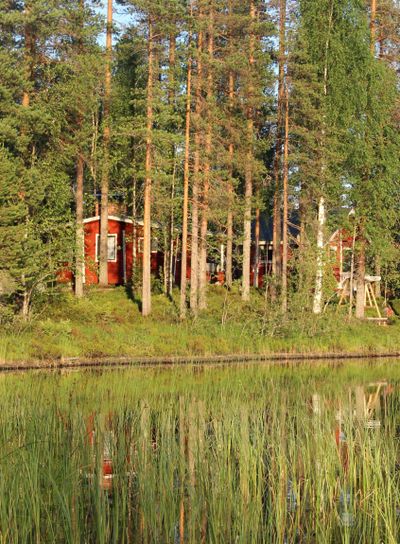 Typical Finnish house in the woods near lake