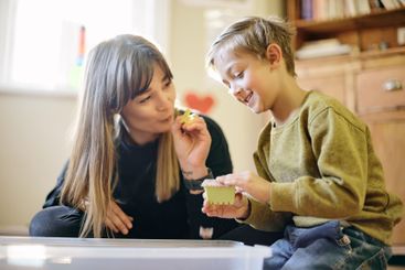 Learning, playing and toys with mother and son for...