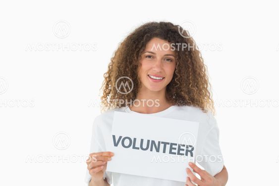 Happy volunteer showing a poster