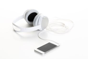 White headphones on white background close up