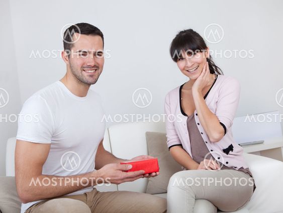 Man giving a present to woman