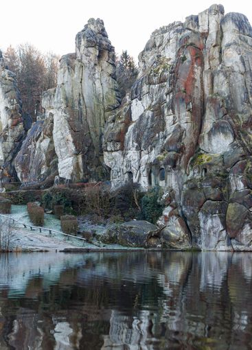 Large rocky rocks on a background of water. Rocks of...