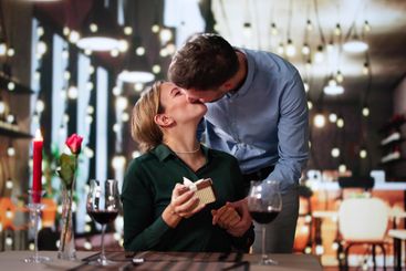 Romantic Couple Sitting Having Dinner