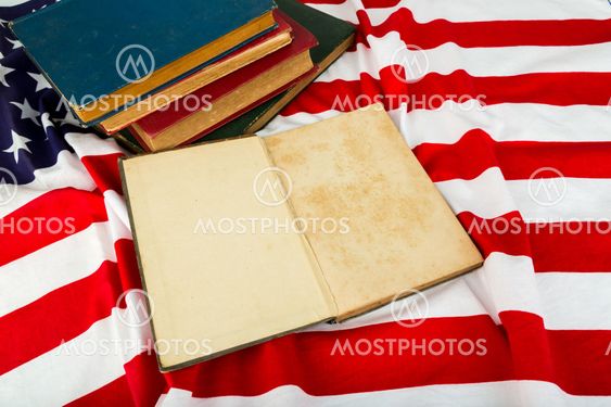 Vintage open book on American flag
