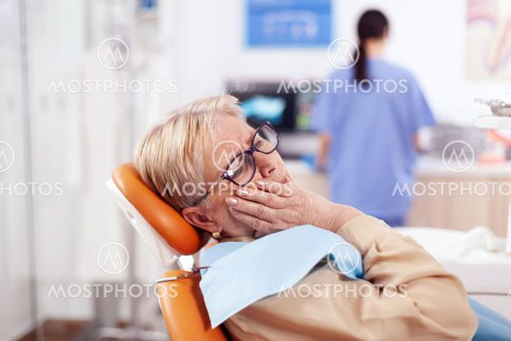 Elderly patient waiting diagnostic from dentist doctor