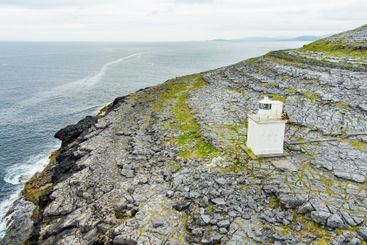 Black Head Lighthouse, situated in the rough rocky...