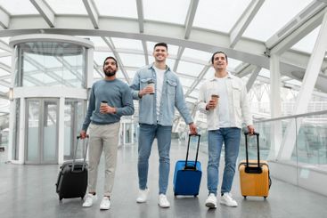 Friends Men Traveling Walking With Suitcases Holding...