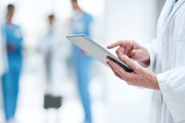 Healthcare, technology and hands of doctor with tablet...