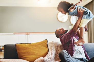 Dad, lift daughter and playing in home, love and parent...