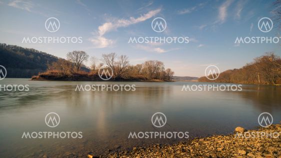 River Landscape with Subtle Blue Water and Sky.