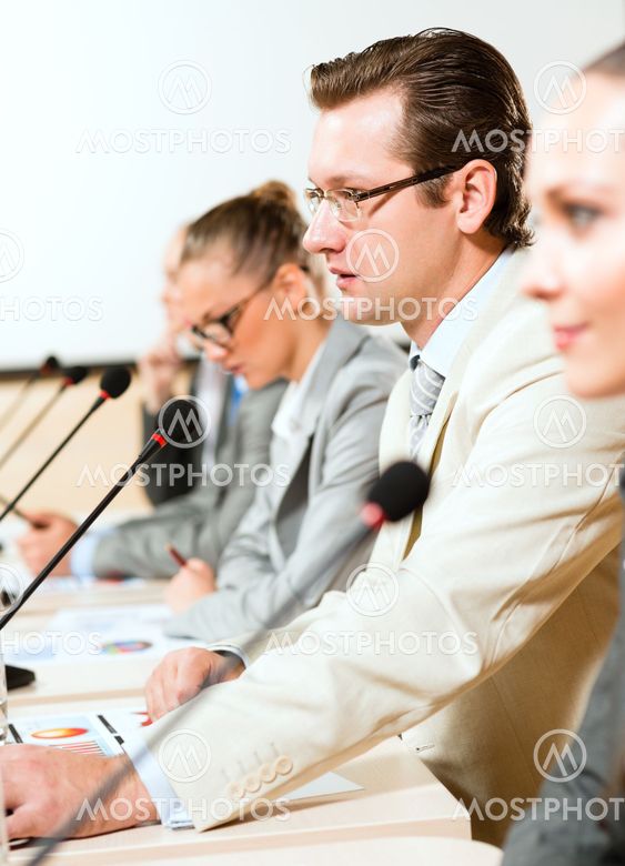 businessmen communicate at the conference