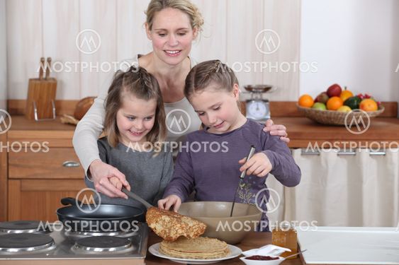Mum and girls making pancakes
