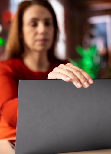 Freelancer at home office focused on online research and...