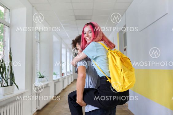 Teenagers boy and girl friends having fun at school