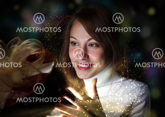 Young woman reading a magic book