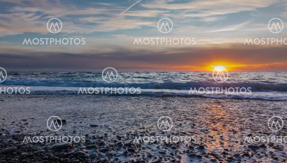 The blue sunset sky with light clouds