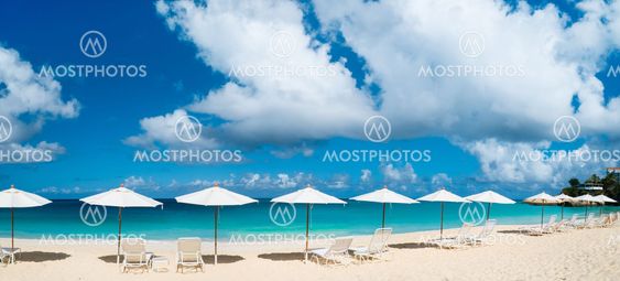 Chairs and umbrellas on tropical beach