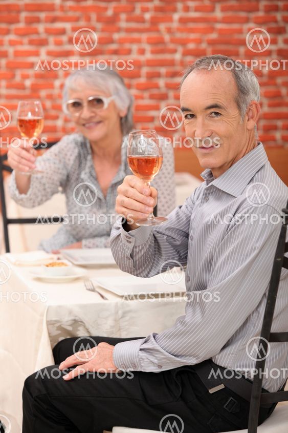 Elderly couple making a toast