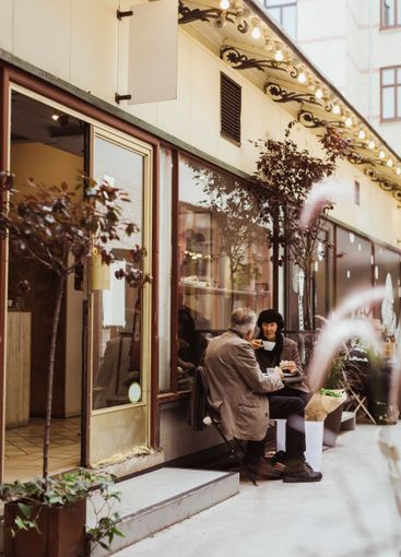 Senior couple having coffee while sitting together...