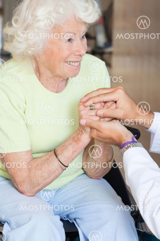 Doctor Comforting Senior Woman