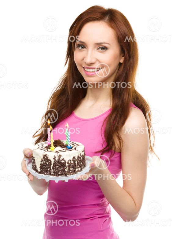 Young woman with anniversary cake