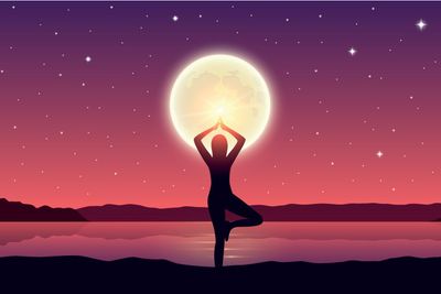 girl makes yoga pose at the lake with full moon and...