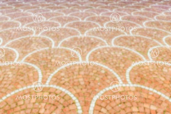 Defocused background of Sampietrini cobblestone pavement in Rome, Italy