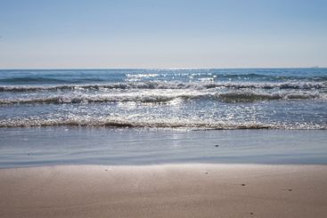 View from seashore of waves on the surface of the sea