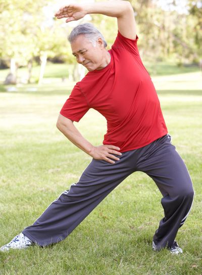 Senior Man Exercising In Park