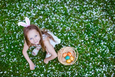 Little girl playing with Easter eggs