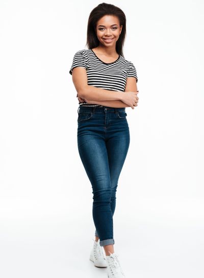 Full length portrait of a smiling casual african woman