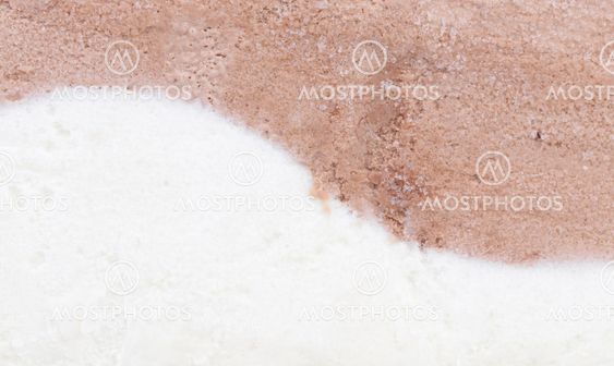 Background of vanilla and chocolate ice cream.