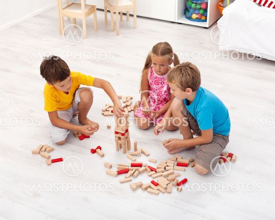 Kids playing with wooden blocks