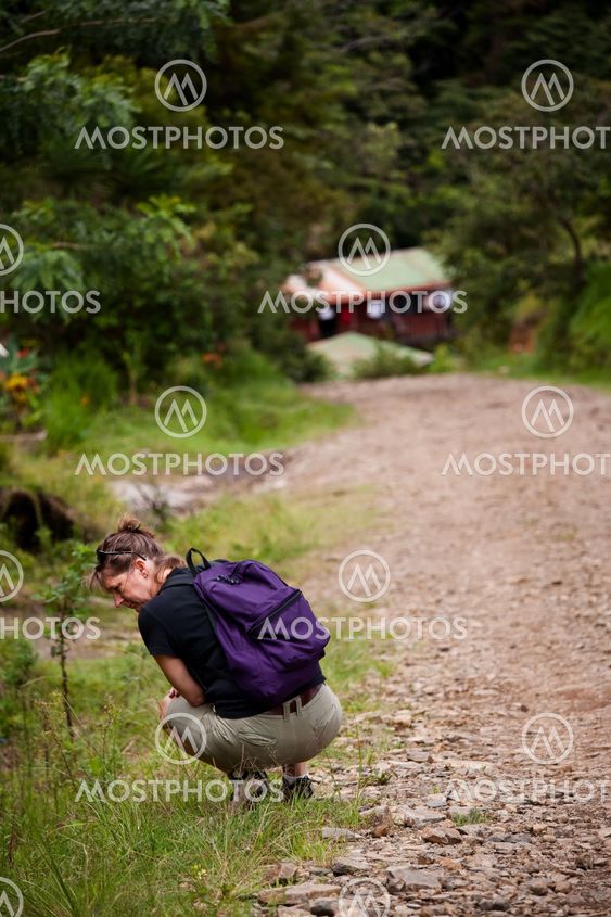 Hiker along side a rugged road in Costa Rica