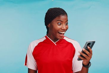 Black woman, phone or happy in studio, sports and...