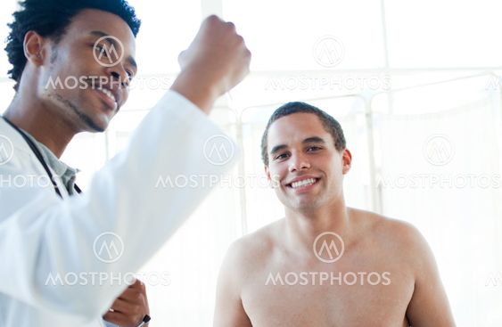 Afro-american doctor checking patient's temperature