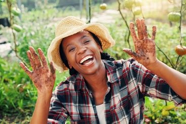 Portrait, dirty hands and black woman in garden, ecology...