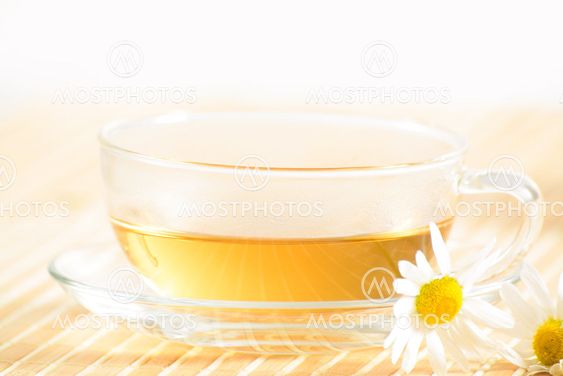 teacup with herbal chamomile tea