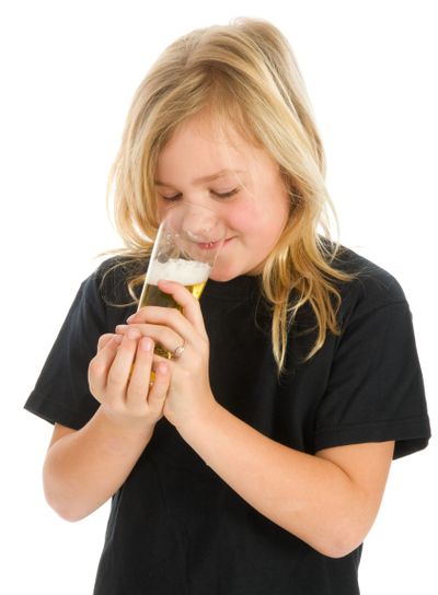 Blond young girl with beer