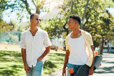 Walking, friends and men with skateboard, fashion and...