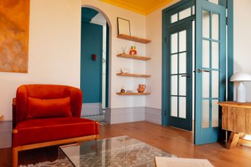 An open blue stylish door to the living room. Soft...