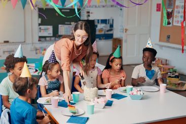 Birthday, celebration and children with teacher in...