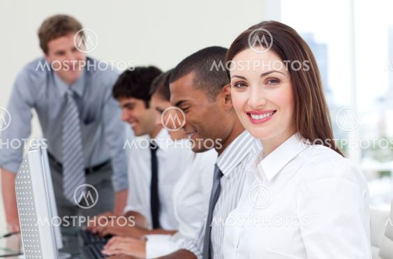 Brunette businesswoman and her team