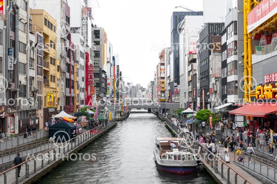 Osaka, Japan - April 2016: Tourist popular shopping scene in Osaka City at Dotonbori Namba area with signs and advertising billboards during daytime