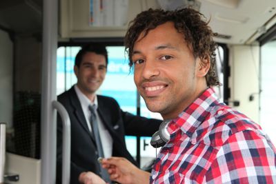 Man paying for bus ticket