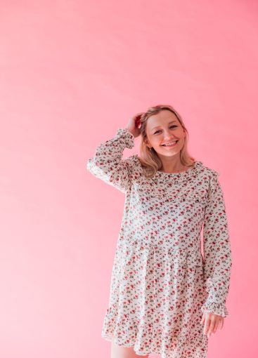 woman in summer dress smiling